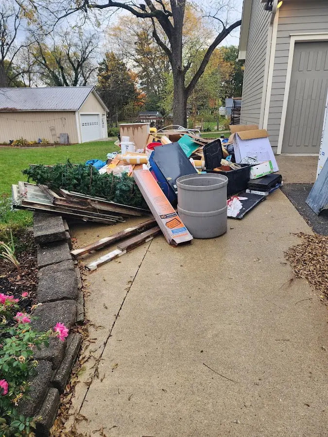 Dumpster being loaded with debris for 30 Yard Dumpster Rental in Union City